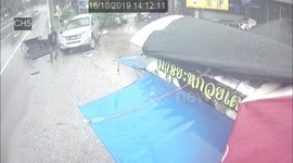 Pickup truck loses control on wet road and smashes into electricity pole