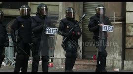 riot police confront protesters at the general strike in barcelona 18 october 2019