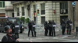 riot police confront protesters at the general strike in barcelona 18 october 2019