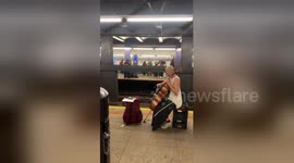 Cellist and violinist perform cross platform duet on New York subway