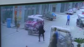 Heroic man stops speeding three-wheeler with toddler inside from hitting glass door in China
