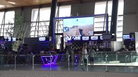 A video game being played on a very large screen.