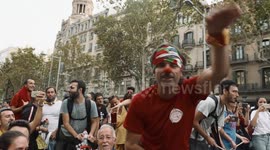 Festive Protesters in the streets of Barcelona play music for Independence rally.
