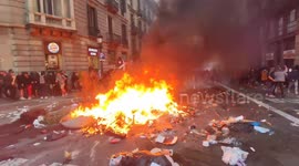 Violent Protesters in the streets of Barcelona confront police with burning barricades