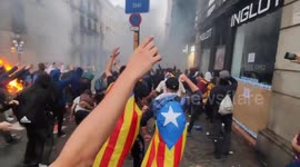 Catalan independence rally turns violent as protestors ignite barricades
