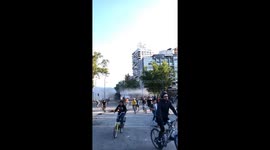 Protesters run for police repression in Chile