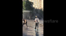 Police fire water cannon as Chilean protesters defy emergency decree