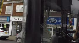 Cyclist spots working bus driver with hands off the wheel and on their phone