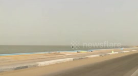 Tourist Traveling Throw Qarun Lake Water Road In Morning