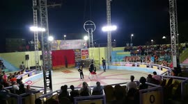 Circus Strong Leg Man Holds Metal Ladder On