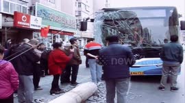 Utility pole narrowly misses Chinese pedestrian after being knocked down by bus