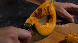 Cutting a piece of pumpkin
