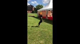 Puppy shows great skill, playing keepy-uppies with a balloon