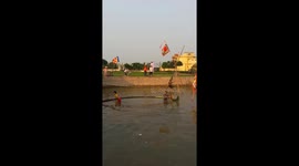 Watch Vietnamese citizens try to capture a flag in the middle of a lake with highly predictable results