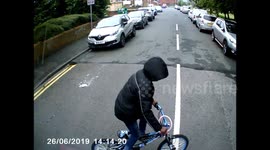 Oblivious kid on bike has near miss with truck and doesn't even look