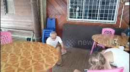 Indigenous in Borneo playing traditional music using a bamboo made instrument