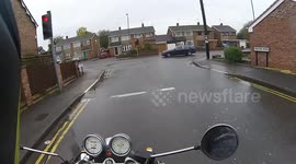 Mobility Scooter Nearly Takes Out Motorcyclist At Traffic Lights