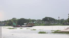 A small local ferry service for cars and motorcycles, at Ayutthaya, Thailand.