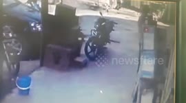 Scary moment pavement caves in injuring two men in northwestern India