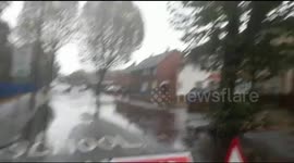 Car Going through Flooded Road In Wednesbury, West Midlands