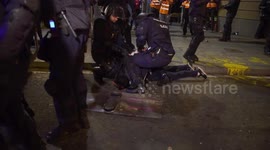 Police pin detained Catalan protesters to ground