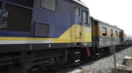 A freight train travels at high speed past my camera.