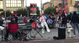 Funny old man dancing at Sf pier
