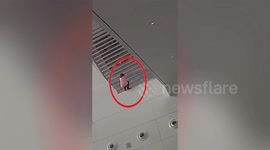 Heroic soldiers catch suicidal woman who jumped off 33ft departure hall at Chinese airport