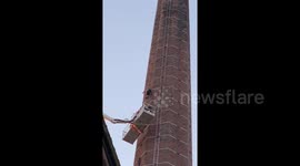 Man hanging upside down from 290ft chimney in England confirmed dead