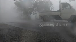 Cars Drive In Violent Hurricane Wind And Extreme Rainfall As Typhoon Lingling Hits