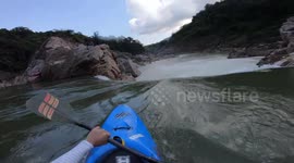 Dramatic video shows German kayaker descend 20ft waterfall in India before he's pulled underwater