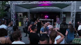 cool female dj perforning at outdoor party in barcelona