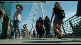 people crossing waterloo foot bridge, london,