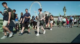 people crossing waterloo foot bridge, london,