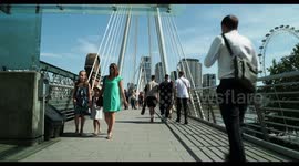 people crossing waterloo foot bridge, london,