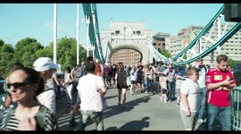 crowds of tourists on tower bridge, london