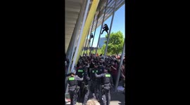 Australian police charge at at crowd at 'IMARC' blockade in Melbourne
