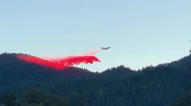 Aircraft drops fire retardant material in attempt to suppress Kincade fire