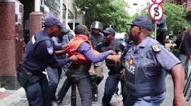 Shocking footage shows riot police using force to remove refugees protesting outside UNHCR building in Cape Town