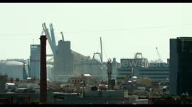 barcelona skyline shot from a high vantage point looking towards the industrial port