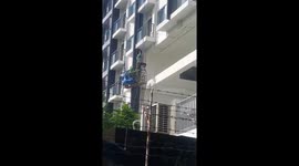 Workers Scale Building Without Safety Gear