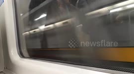 Jubilee line train speeds through Southwark after station fire alert
