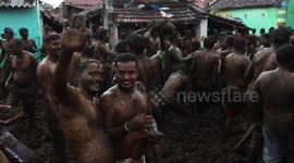 Hindu men take part in massive cow dung fight at festival in southern India