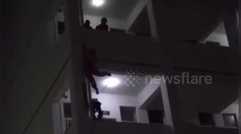Chinese fireman kicks suicidal student back onto balcony