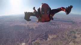 Moment a Marvel fan has celebrated his 100th skydive - by jumping dressed as Deadpool