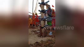 Newsflare Edit - Two men overcome the challenge of climbing the knife trees during the festival in Vietnam