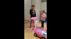 Young girls singing and dancing to spicegirls