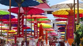 Buddhist temple decorated with hundreds of colourful umbrellas to honour water goddess