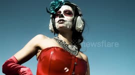 woman dancing with dia de los muertos/day of the dead makeup