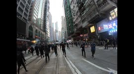 Hong Kong Protesters run away as riot police shoots tear gas